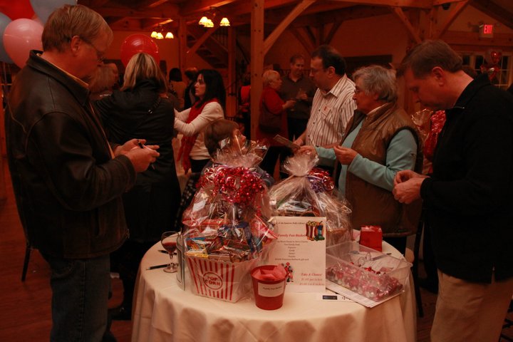 Looking at items on the charity table.