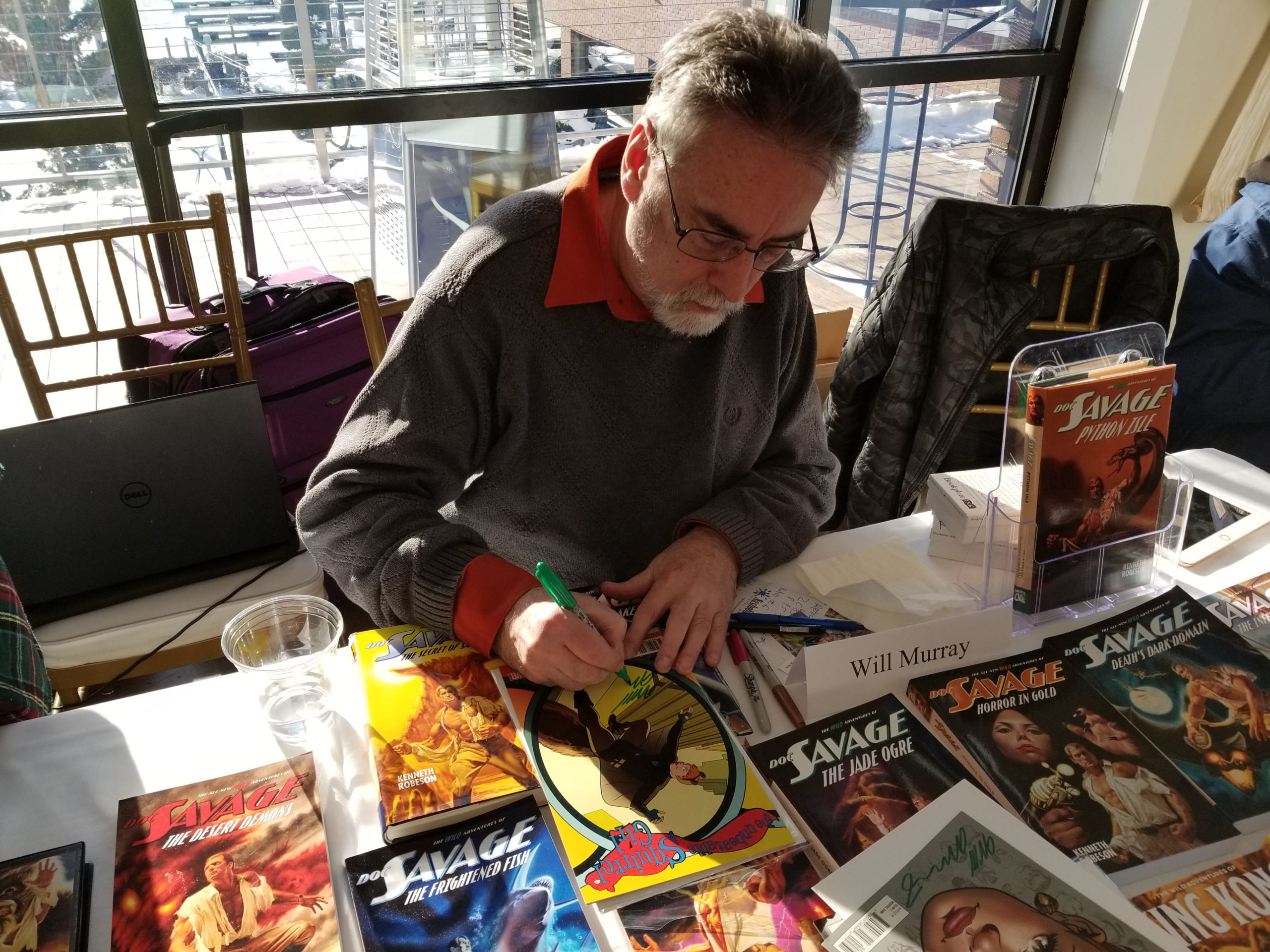 Will Murray signing a Squirrel Girl comic book. 